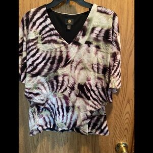 Top with draped outer shell